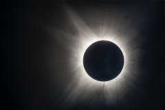 Composite of totality with solar flare and promence